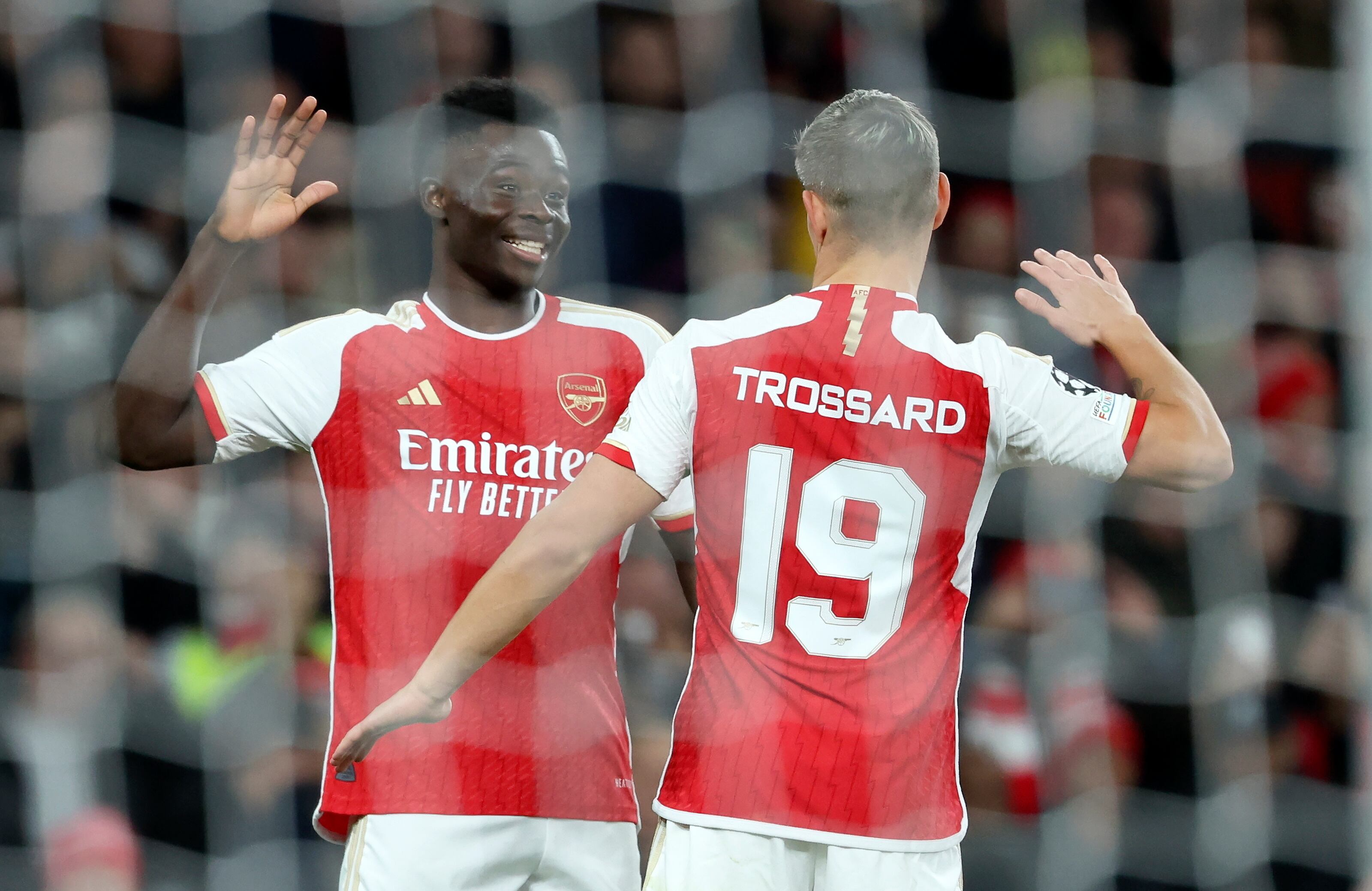 Bukayo Saka of Arsenal celebrates with teammate Leandro Trossard (R) after scoring the 2-0 lead during the UEFA Champions League Group B match between Arsenal vs Sevilla FC in London, Britain, 08 November 2023. (Liga de Campeones, Reino Unido, Londres) EFE/EPA/ISABEL INFANTES