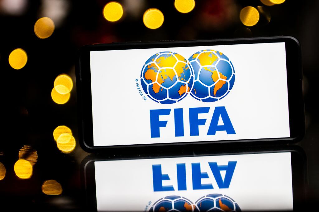 POLAND - 2023/01/06: In this photo illustration a FIFA logo seen displayed on a smartphone. (Photo Illustration by Mateusz Slodkowski/SOPA Images/LightRocket via Getty Images)