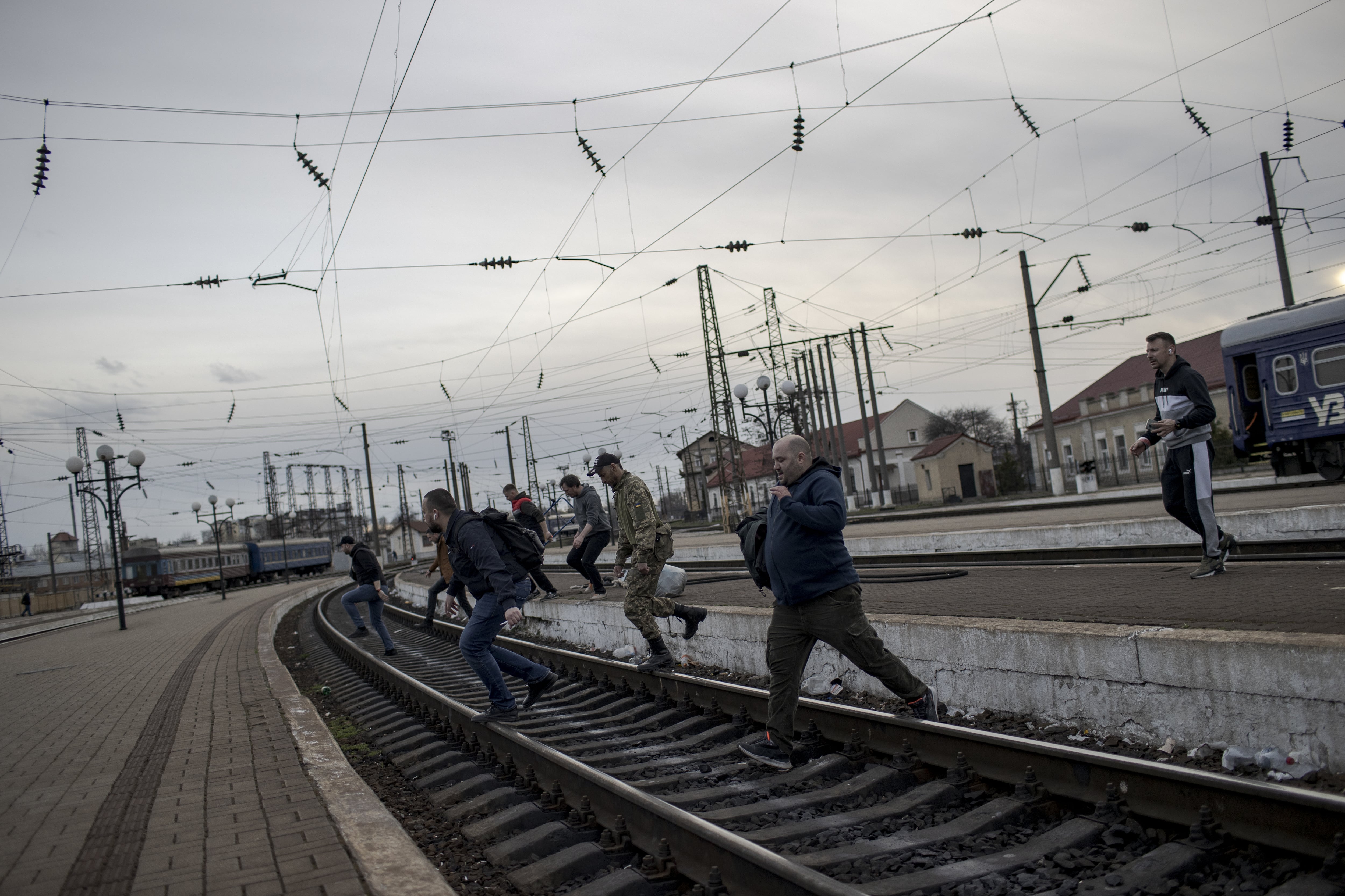 LVIV, UKRAINE â APRIL 9: Volunteers and soldiers carry basic necessities such as food, clothes, blankets, baby foods to train, to be arrived at Kharkiv, in Lviv, Ukraine on April 9, 2922. Intense movement of civilians continue due to war that started with Russian attacks on Ukraine. Support desk is set up by volunteers to help elderly or disabled people and to provide food, shelter and psychological support to refugees at Lviv train station. (Photo by Ozge Elif Kizil/Anadolu Agency via Getty Images)