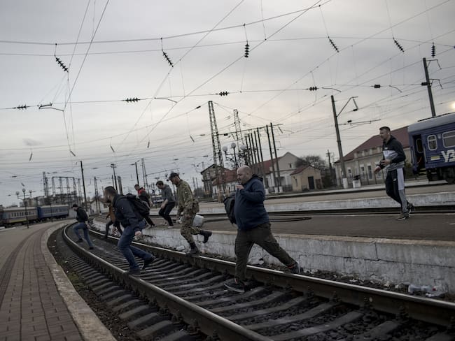 LVIV, UKRAINE â APRIL 9: Volunteers and soldiers carry basic necessities such as food, clothes, blankets, baby foods to train, to be arrived at Kharkiv, in Lviv, Ukraine on April 9, 2922. Intense movement of civilians continue due to war that started with Russian attacks on Ukraine. Support desk is set up by volunteers to help elderly or disabled people and to provide food, shelter and psychological support to refugees at Lviv train station. (Photo by Ozge Elif Kizil/Anadolu Agency via Getty Images)