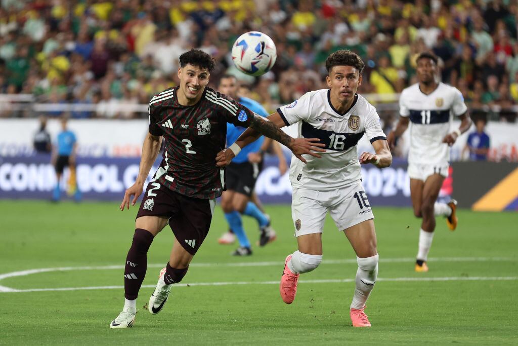 Jorge Sanchez of Mexico and Jeremy Sarmiento of Ecuador battle for possession during the CONMEBOL Copa America 2024 Group D match between Mexico and Ecuador at State Farm Stadium on June 30, 2024 in Glendale, Arizona. (Photo by Steph Chambers/Getty Images)