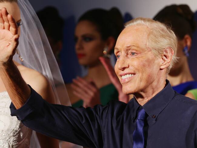 ROME, ITALY - JANUARY 26: Designer Renato Balestra acknowledges the applause of the public after the Renato Balestra fashion show at Altaroma Altamoda on January 26, 2014 in Rome, Italy. (Photo by Vittorio Zunino Celotto/Getty Images)