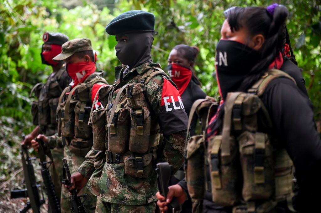 Members of the Ernesto Che Guevara front, belonging to the National Liberation Army (ELN) guerrillas, line up  at the jungle, in Choco department in Colombia, on May 23, 2019. - The ELN or National Liberation Army is Colombia's last rebel army and one of the oldest guerrillas in Latin America. (Photo by Raul ARBOLEDA / AFP)        (Photo credit should read RAUL ARBOLEDA/AFP via Getty Images)