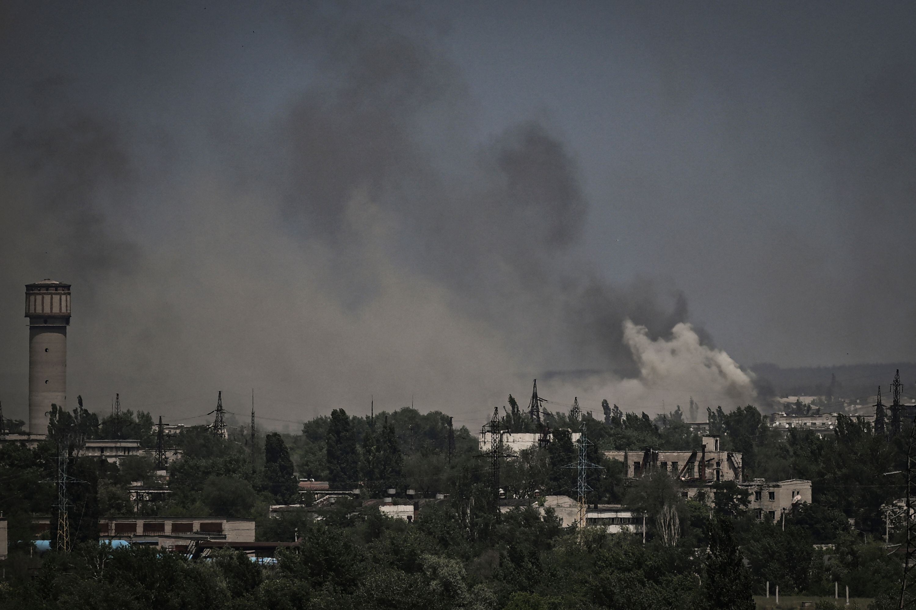 Smoke and dirt rise in the city of Severodonetsk during fighting between Ukrainian and Russian troops at the eastern Ukrainian region of Donbas on June 2, 2022. (Photo by ARIS MESSINIS / AFP) (Photo by ARIS MESSINIS/AFP via Getty Images)