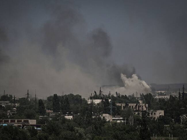 Smoke and dirt rise in the city of Severodonetsk during fighting between Ukrainian and Russian troops at the eastern Ukrainian region of Donbas on June 2, 2022. (Photo by ARIS MESSINIS / AFP) (Photo by ARIS MESSINIS/AFP via Getty Images)