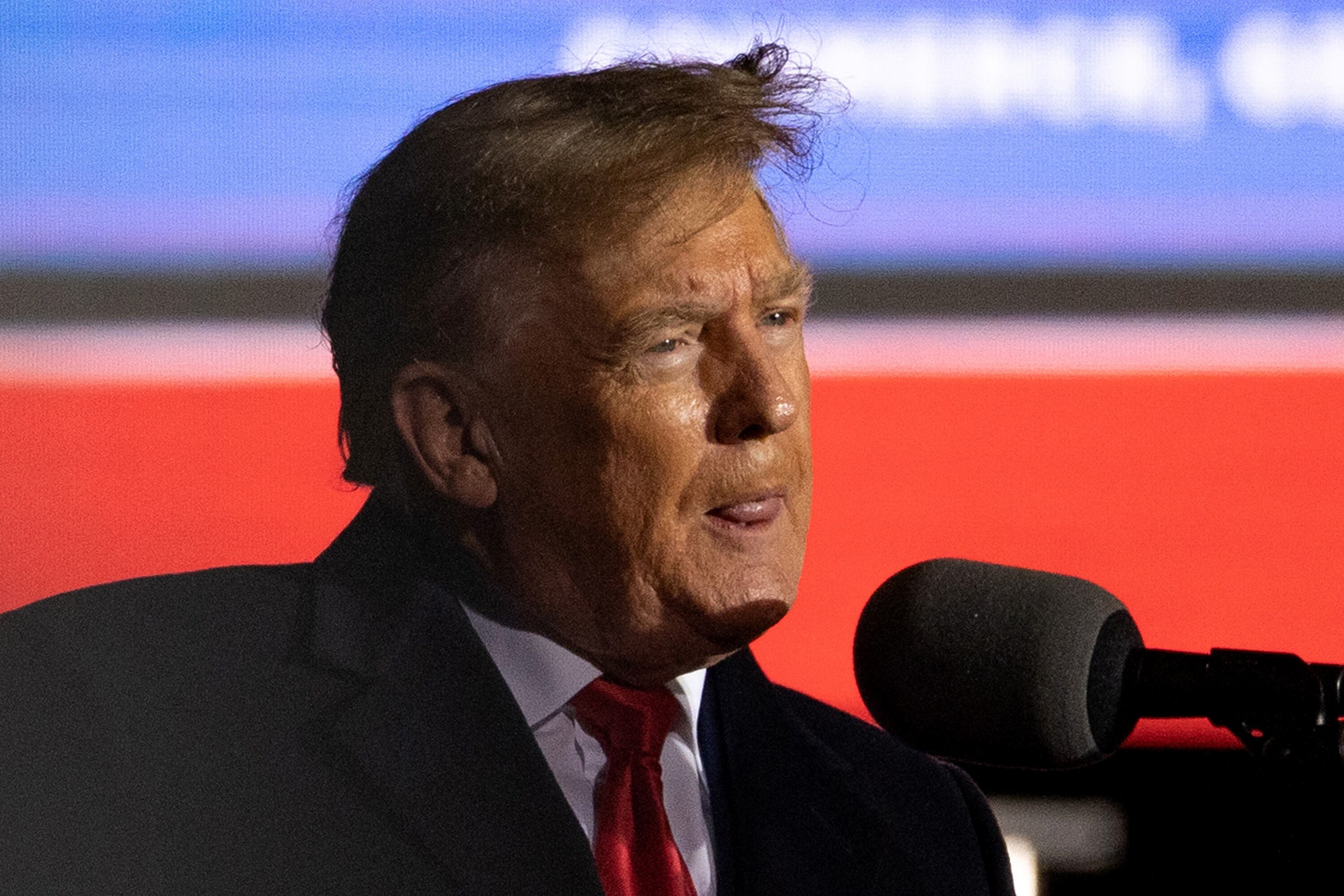COMMERCE, GA - MARCH 26: (EDITOR'S NOTE: Alternative crop of image #1239538323) Former U.S. President Donald Trump speaks at a rally at the Banks County Dragway on March 26, 2022 in Commerce, Georgia. This event is a part of Trump's Save America Tour around the United States. (Photo by Megan Varner/Getty Images)