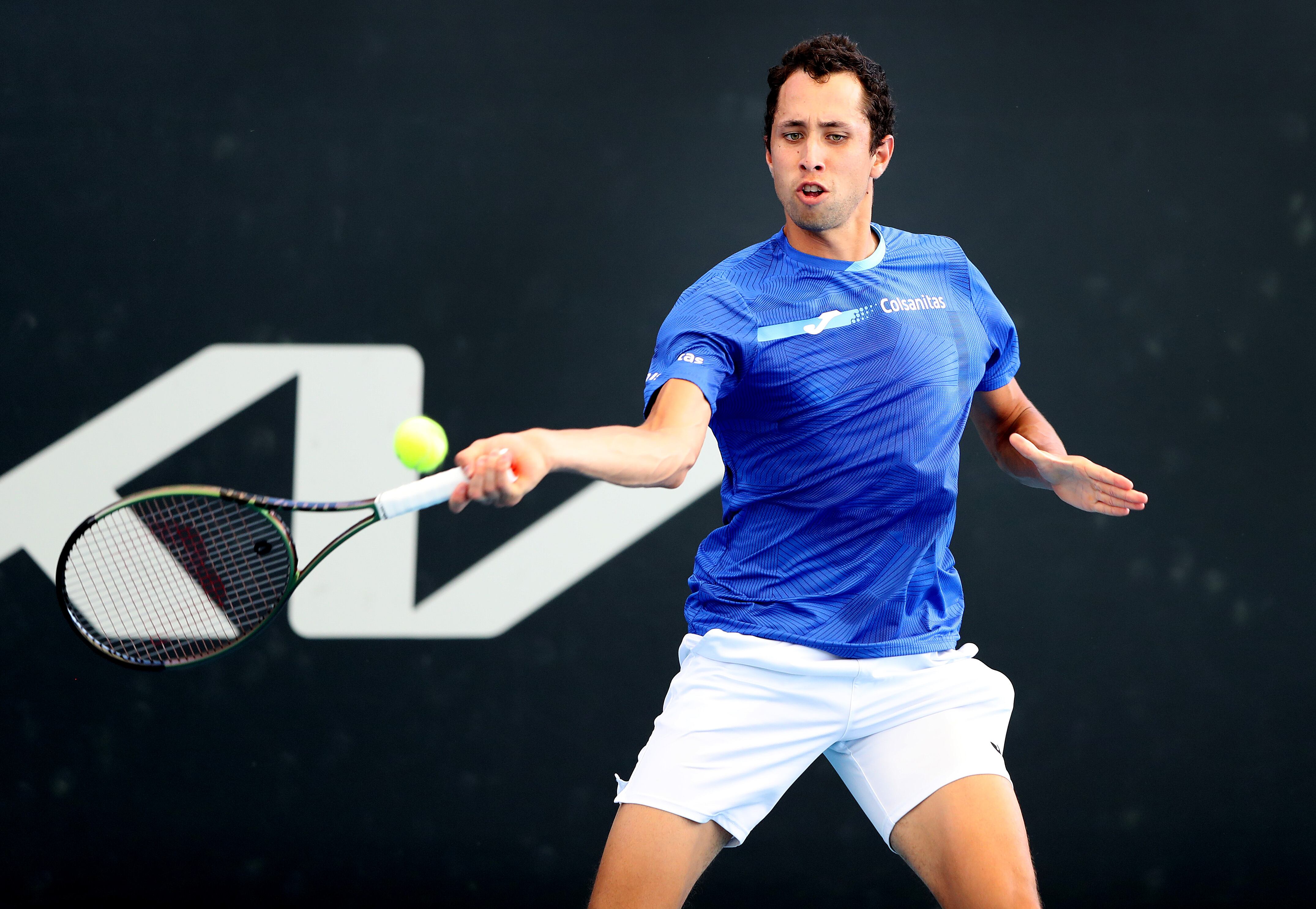 ADELAIDE, AUSTRALIA - JANUARY 02:  Daniel Elahi Galan of Columbia in action against Matthew Ebden of Australia during day one of the 2022 Adelaide International at Memorial Drive on January 02, 2022 in Adelaide, Australia. (Photo by Sarah Reed/Getty Images)