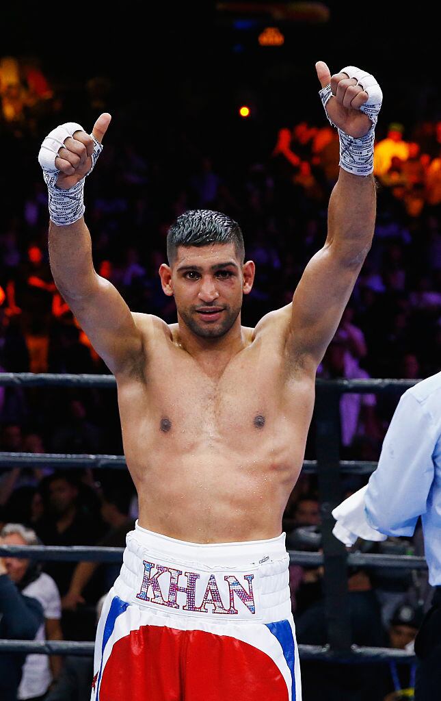 NEW YORK, NY - MAY 29: Amir Khan raises his arms in victory after a unanimous decision win against Chris Algieri after their Welterweight bout at Barclays Center of Brooklyn on May 29, 2015 in New York City. (Photo by Al Bello/Getty Images)