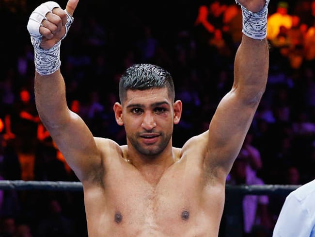 NEW YORK, NY - MAY 29:  Amir Khan raises his arms in victory after a unanimous decision win against Chris Algieri after their Welterweight bout at Barclays Center of Brooklyn on May 29, 2015 in New York City.  (Photo by Al Bello/Getty Images)