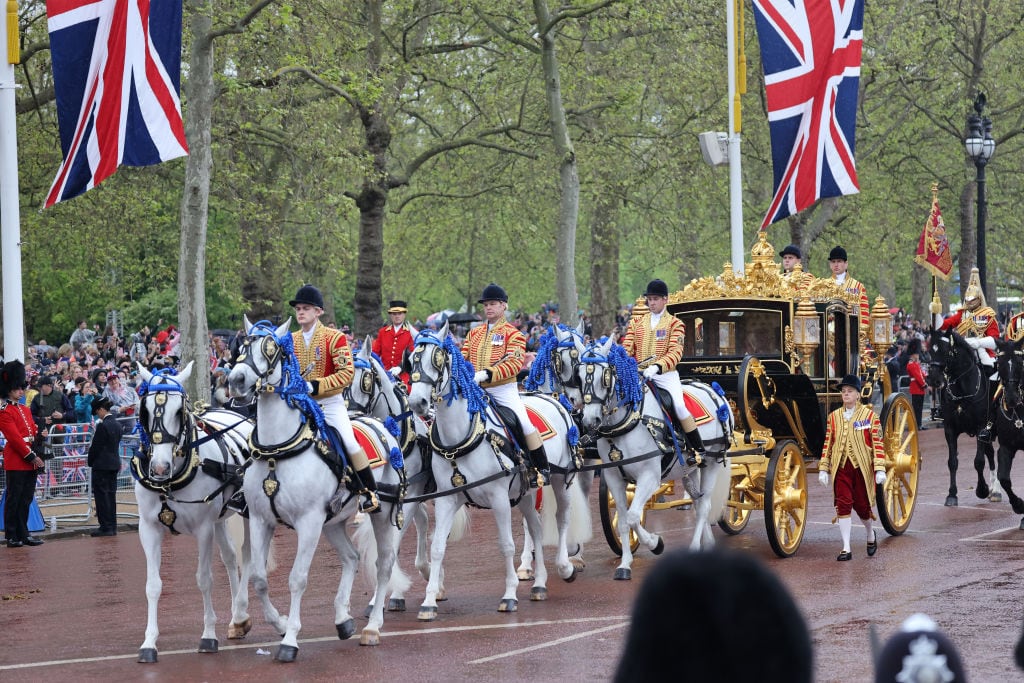 LONDON, ENGLAND - MAY 06: King Charles III and Camilla, Queen Consort make their way down The Mall from Buckingham Palace towards Westminster Abbey in the Diamond Jubilee State Coach during the Coronation of King Charles III and Queen Camilla on May 06, 2023 in London, England. The Coronation of Charles III and his wife, Camilla, as King and Queen of the United Kingdom of Great Britain and Northern Ireland, and the other Commonwealth realms takes place at Westminster Abbey today. Charles acceded to the throne on 8 September 2022, upon the death of his mother, Elizabeth II. (Photo by Neil Mockford/Getty Images)