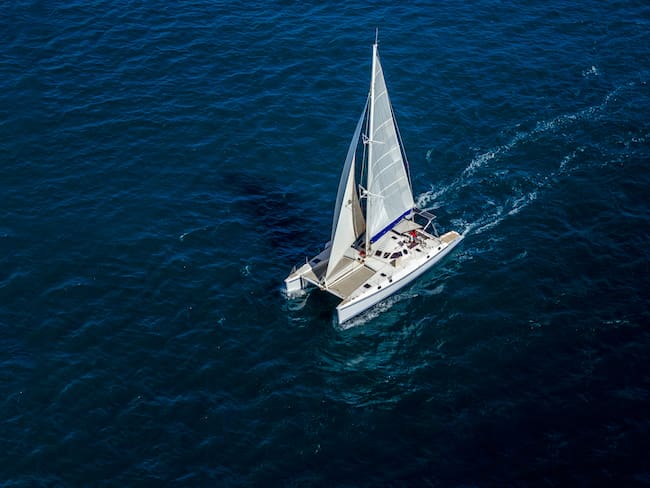 Aerial view of a catamaran sailing in the Indian Ocean