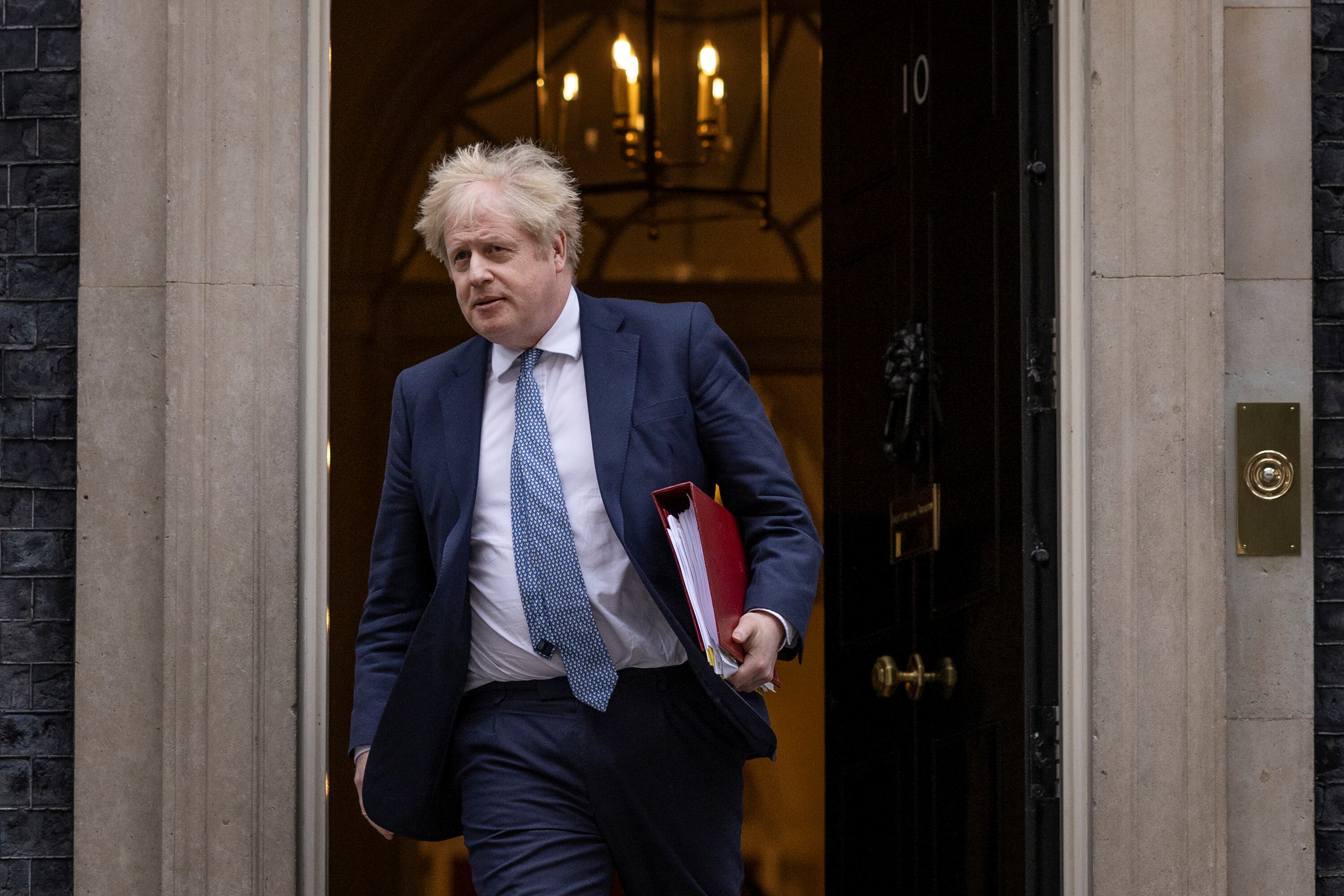 LONDON, ENGLAND - FEBRUARY 02: British Prime Minister Boris Johnson leaves 10 Downing Street to attend the weekly Prime Ministers Questions on February 02, 2022 in London, England. Boris Johnson holds his first Prime Minister's Questions since the Sue Gray Report into "Partygate" has been made public. (Photo by Dan Kitwood/Getty Images)