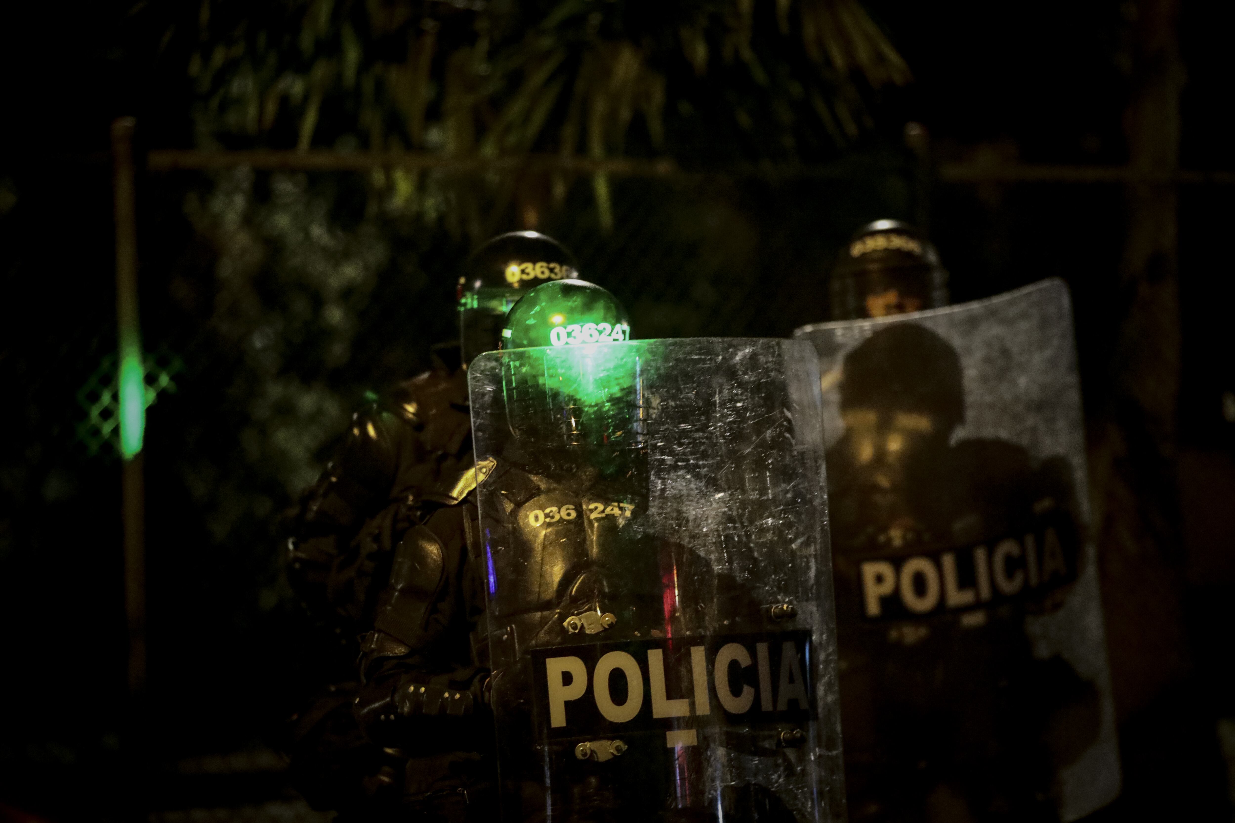 BOGOTA, COLOMBIA - SEPTEMBER 09: Mobile Anti-Disturbances Squadron Police riot (ESMAD) take measures during a protest to commemorate the year when ten people died and more than a hundred injured in protests following the death of a Javier Ordonez in Bogota on September 9, 2021. Last year September 9, has become a date of national outrage in the country, where protests sparked by the death of a civilian Javier Ordonez at the hands of the Colombian National Police, and left more than 10 people killed and hundreds injured. (Photo by Juancho Torres/Anadolu Agency via Getty Images)
