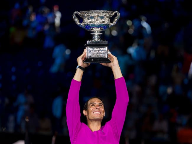 MELBOURNE, AUSTRALIA - JANUARY 30: Rafael Nadal of Spain poses with the Norman Brookes Challenge Cup as he celebrates victory in his Men’s Singles Final match against Daniil Medvedev of Russia during day 14 of the 2022 Australian Open at Melbourne Park on January 30, 2022 in Melbourne, Australia. (Photo by Andy Cheung/Getty Images)