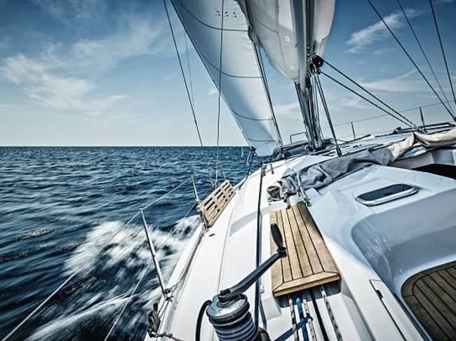 Sailing with sailboat. Long exposure.