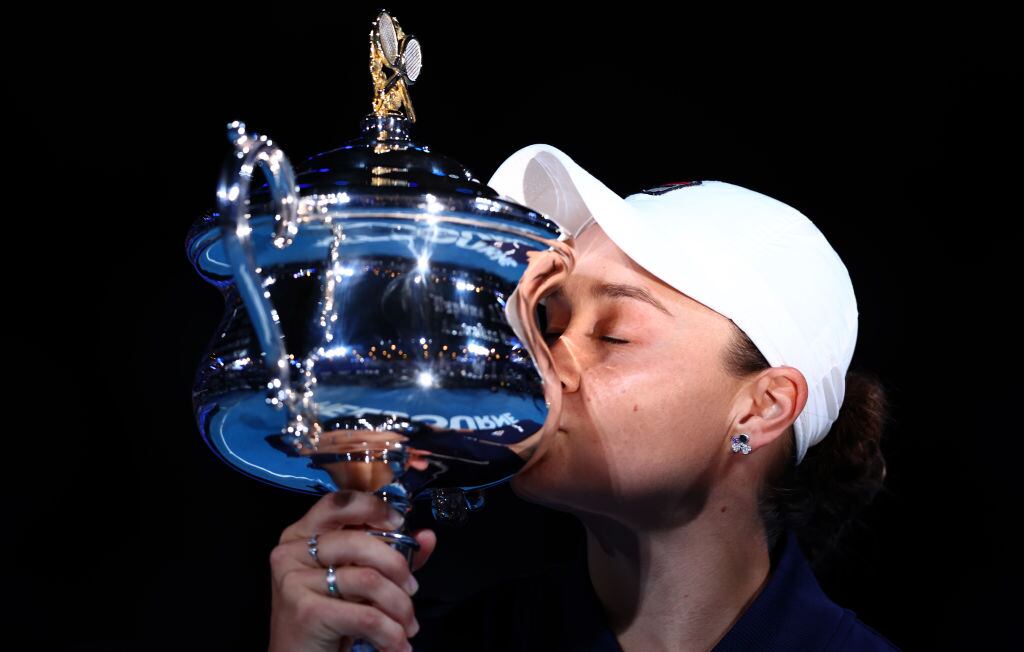 MELBOURNE, AUSTRALIA - JANUARY 29: Ashleigh Barty of Australia kisses the Daphne Akhurst Memorial Cup after winning her Women’s Singles Final match against Danielle Collins of United States during day thirteen of the 2022 Australian Open at Melbourne Park on January 29, 2022 in Melbourne, Australia. (Photo by Clive Brunskill/Getty Images)