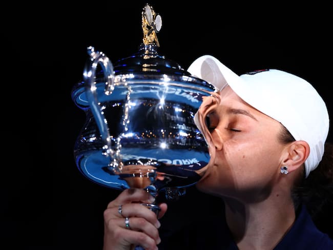MELBOURNE, AUSTRALIA - JANUARY 29: Ashleigh Barty of Australia kisses the Daphne Akhurst Memorial Cup after winning her Women’s Singles Final match against Danielle Collins of United States during day thirteen of the 2022 Australian Open at Melbourne Park on January 29, 2022 in Melbourne, Australia. (Photo by Clive Brunskill/Getty Images)