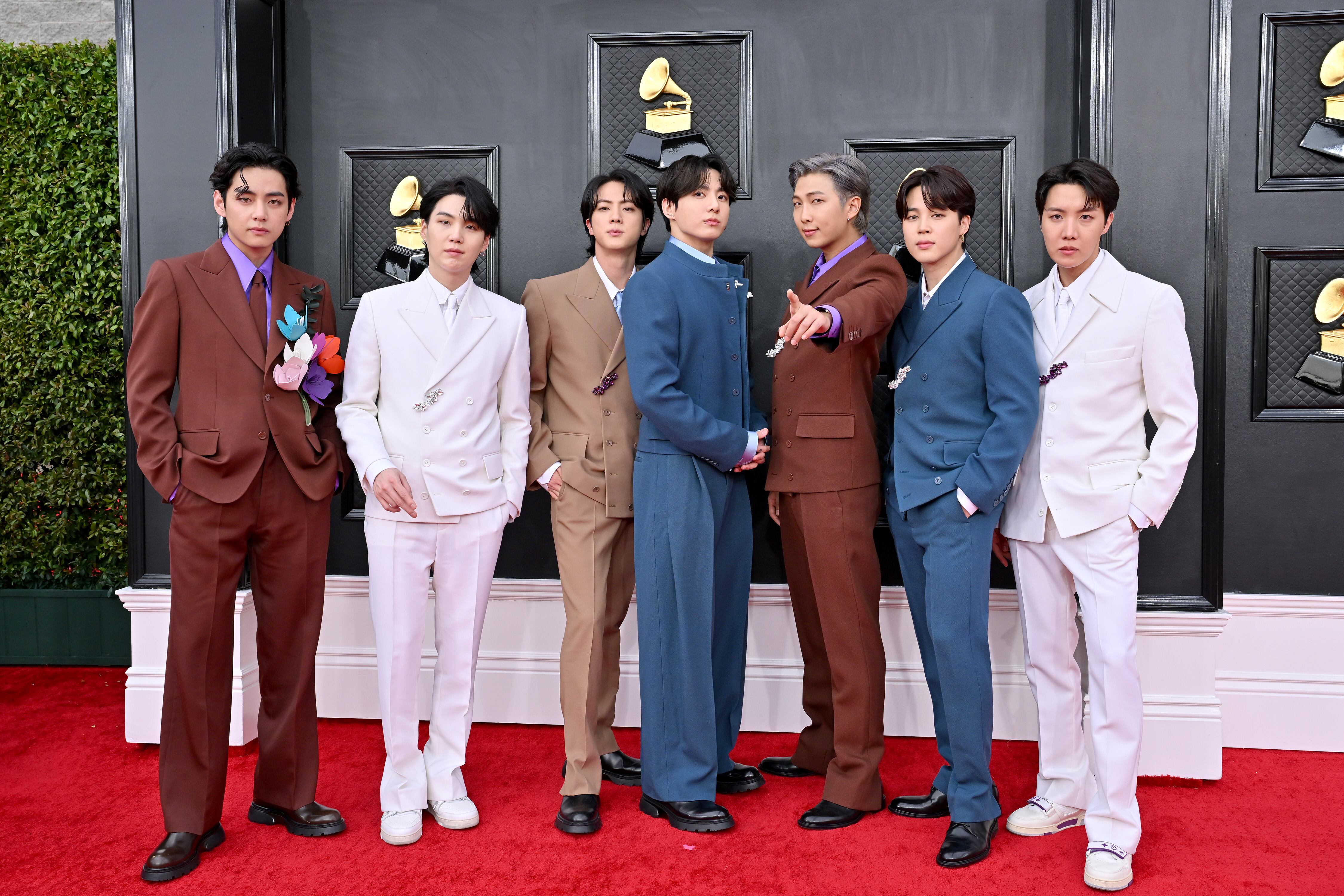 LAS VEGAS, NEVADA - APRIL 03: (L-R) V, Suga, Jin, Jungkook, RM, Jimin and J-Hope of BTS attends the 64th Annual GRAMMY Awards at MGM Grand Garden Arena on April 03, 2022 in Las Vegas, Nevada. (Photo by Axelle/Bauer-Griffin/FilmMagic)