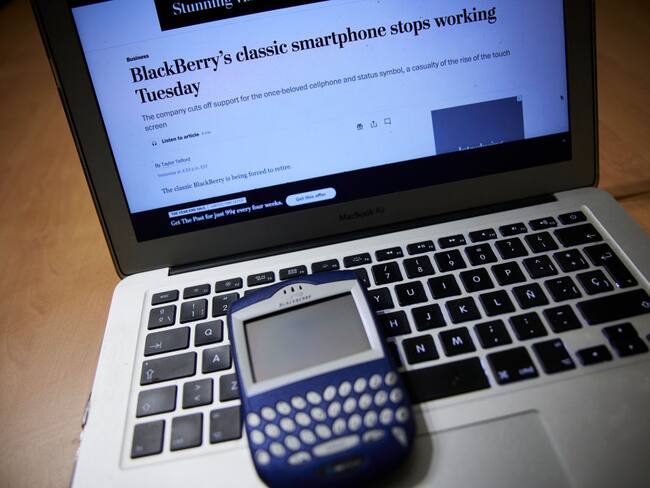 MADRID, SPAIN - JANUARY 04: A BlackBerry terminal with a laptop on the day that BlackBerry phones have stopped working forever, on January 4, 2022, in Madrid, Spain. By decision of the Canadian company, all BlackBerry phones with operating systems 7.1, 10; PlayBook OS 2.1; and previous, have stopped working from today. BlackBerry, which in 2015 decided to become a software company leaving behind mobile telephony, has ensured that from today, data, calls, text messages and emergency calls will stop working "reliably". (Photo By Jesus Hellin/Europa Press via Getty Images)
