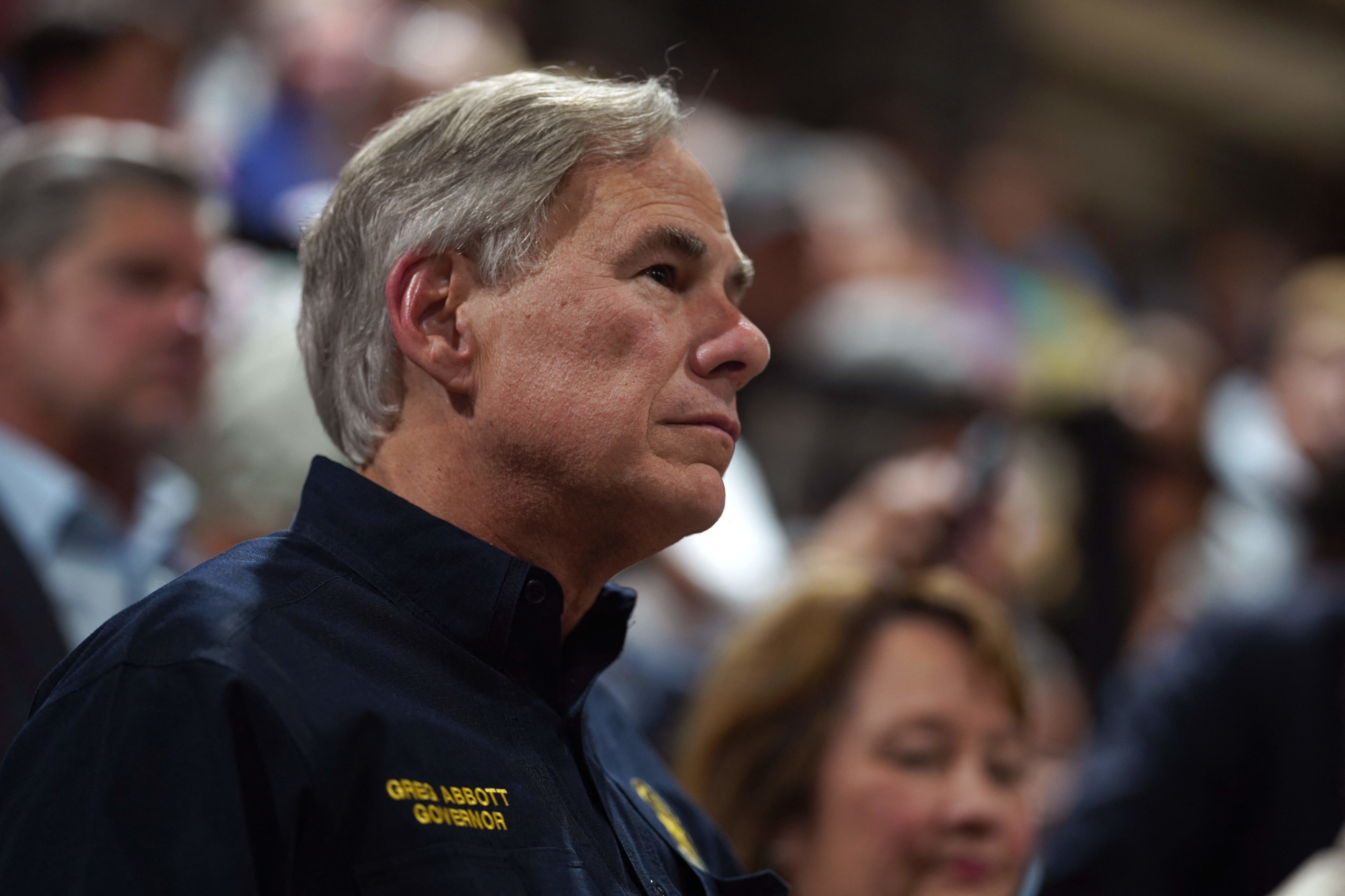 Texas Governor Greg Abbott attends a vigil for the victims of the mass shooting at Robb Elementary School in Uvalde, Texas on May 25, 2022. - The tight-knit Latino community of Uvalde was wracked with grief Wednesday after a teen in body armor marched into the school and killed 19 children and two teachers, in the latest spasm of deadly gun violence in the US. (Photo by allison dinner / AFP) (Photo by ALLISON DINNER/AFP via Getty Images)