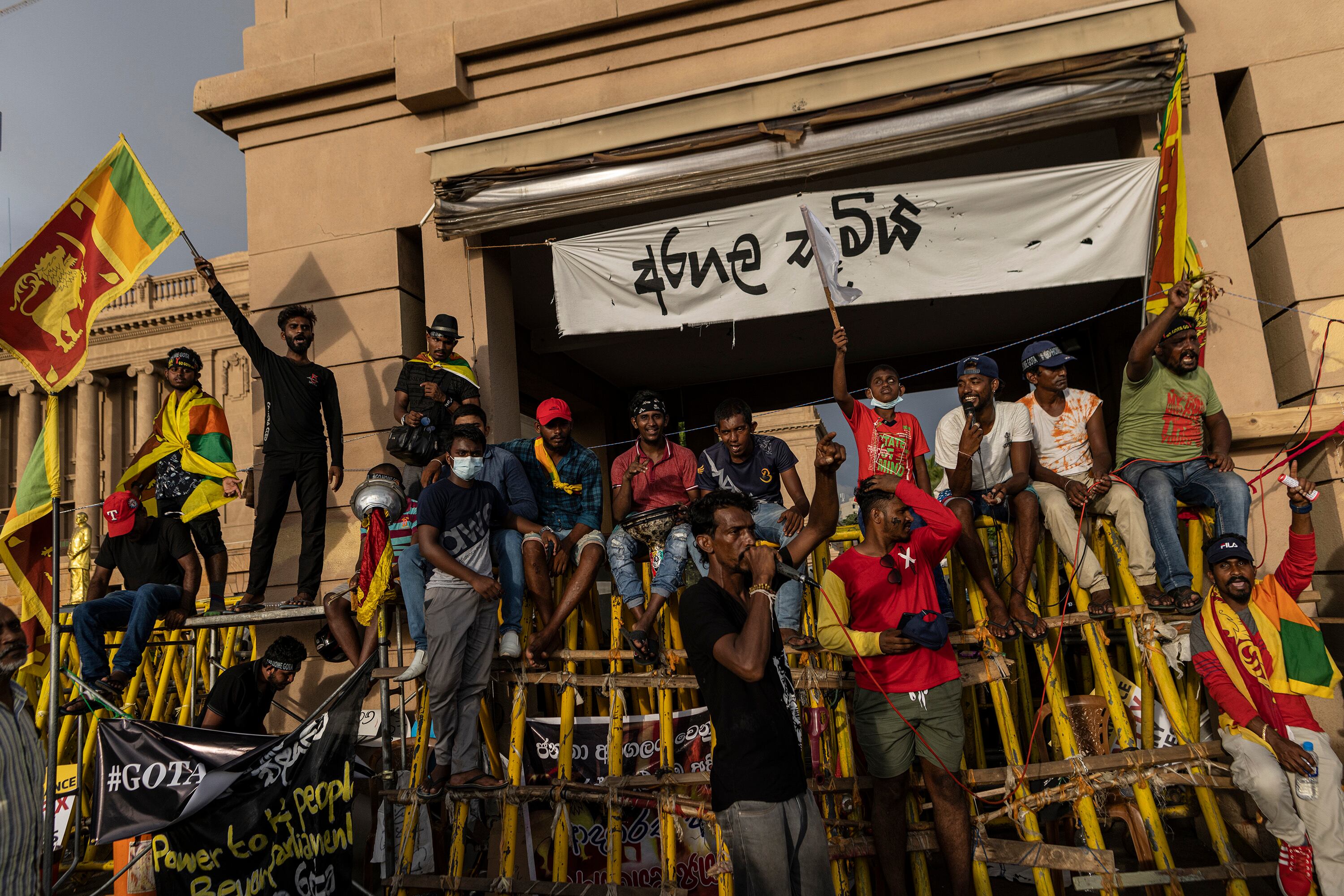 COLOMBO, SRI LANKA - APRIL 23: Demonstrators shout slogans while they take part in a protest against Sri Lankan President Gotabaya Rajapaksa outside the president's office on April 23, 2022 in Colombo, Sri Lanka. Street protests have increased island-wide with pressure building for Sri Lanka’s president Gotabaya Rajapaksa and his government to resign. One protester was shot and killed by police on Tuesday in Rambukkana, during a demonstration against the shortage of fuel. (Photo by Buddhika Weerasinghe/Getty Images)