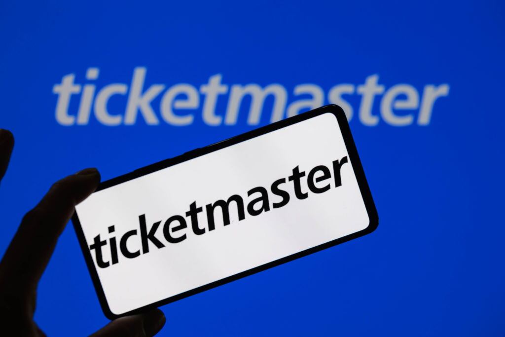 The Ticketmaster logo is being displayed on a smartphone with Ticketmaster visible in the background, in this photo illustration in Brussels, Belgium, on June 2, 2024. (Photo by Jonathan Raa/NurPhoto via Getty Images)