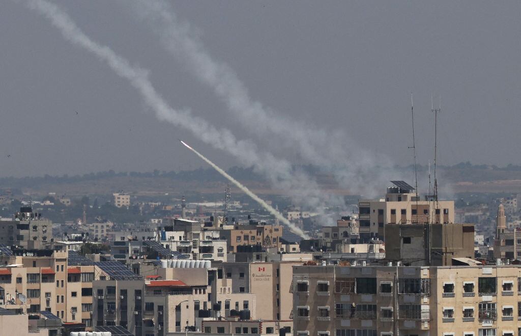 Rockets are fired from Gaza City towards Israel, on May 10, 2023. Israel's army and Gaza militants traded heavy cross-border fire on May 10, with 22 Palestinians killed over two days amid the worst escalation of violence to hit the coastal territory in months. (Photo by Mahmud HAMS / AFP) (Photo by MAHMUD HAMS/AFP via Getty Images)