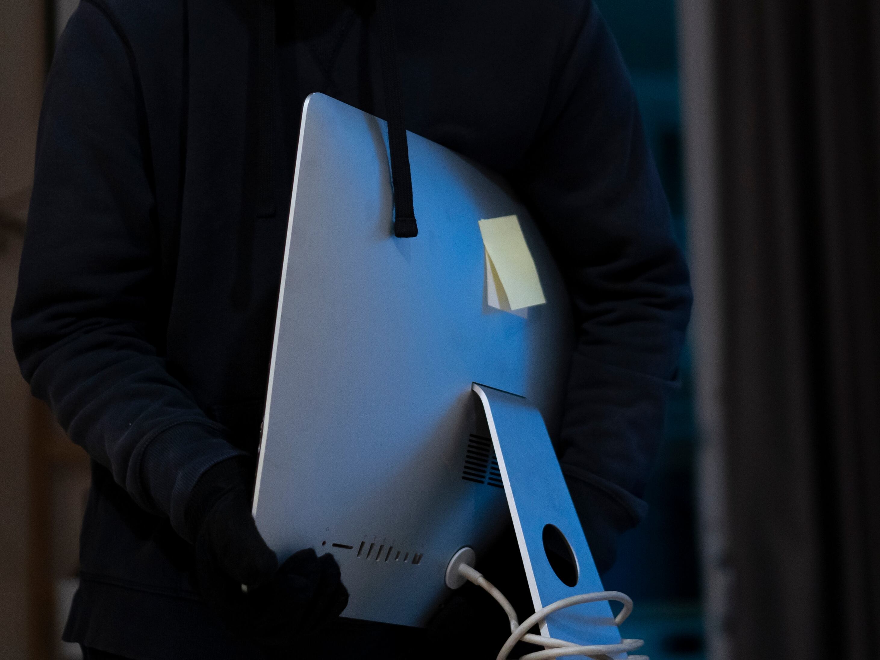 Thieves steal laptops at home at night.