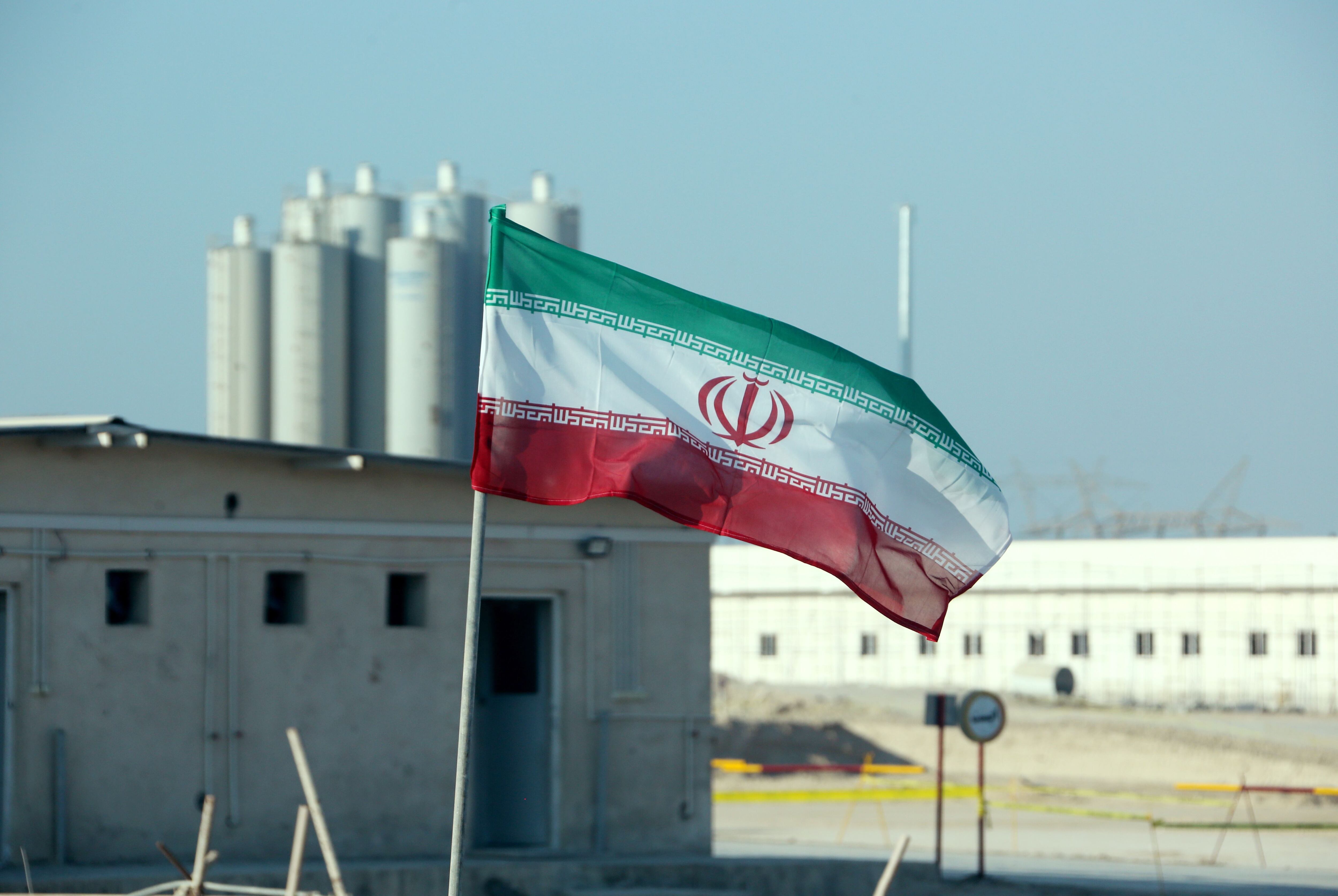 A picture taken on November 10, 2019, shows an Iranian flag in Iran's Bushehr nuclear power plant, during an official ceremony to kick-start works on a second reactor at the facility. - Bushehr is Iran's only nuclear power station and is currently running on imported fuel from Russia that is closely monitored by the UN's International Atomic Energy Agency. (Photo by ATTA KENARE / AFP) (Photo by ATTA KENARE/AFP via Getty Images)