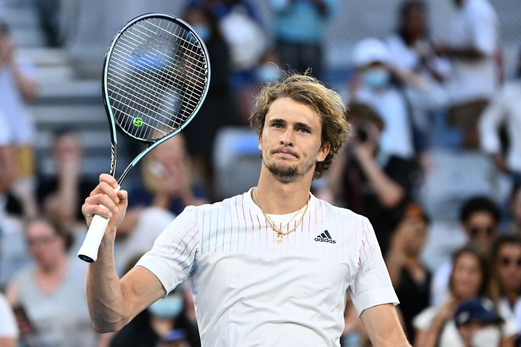 MELBOURNE, AUSTRALIA - JANUARY 21: Alexander Zverev of Germany celebrates match point in his third round singles match against Radu Albot of Moldova during day five of the 2022 Australian Open at Melbourne Park on January 21, 2022 in Melbourne, Australia. (Photo by Quinn Rooney/Getty Images)
