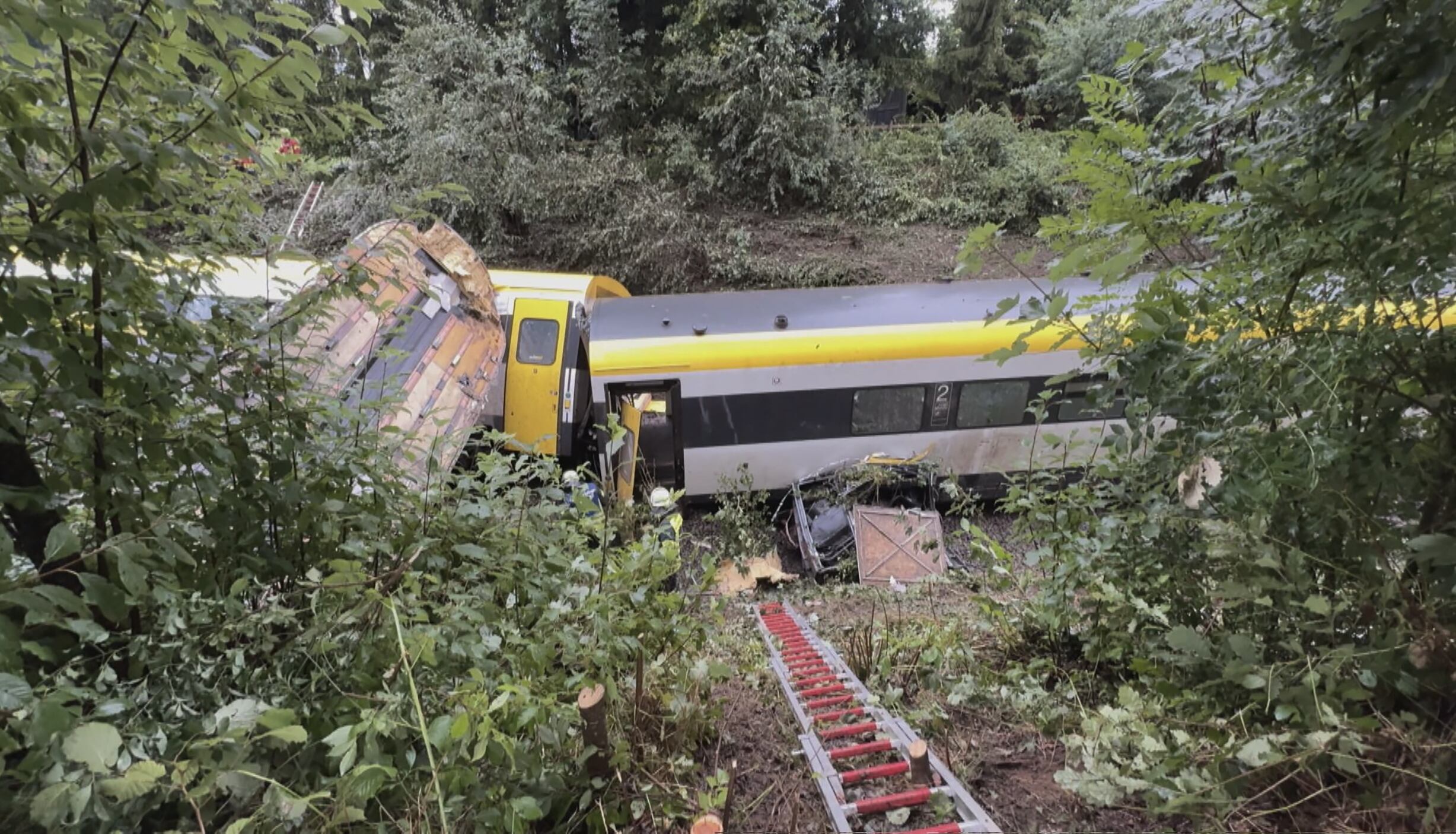 A derailed train is pictured near Riedlingen near Biberach an der Riss on July 27, 2025. The derailment of a passenger train in southwestern Germany on July 27, 2025 evening resulted in at least three deaths and several injuries, according to the latest report communicated by federal police to AFP. (Photo by NonStopNews / AFP)