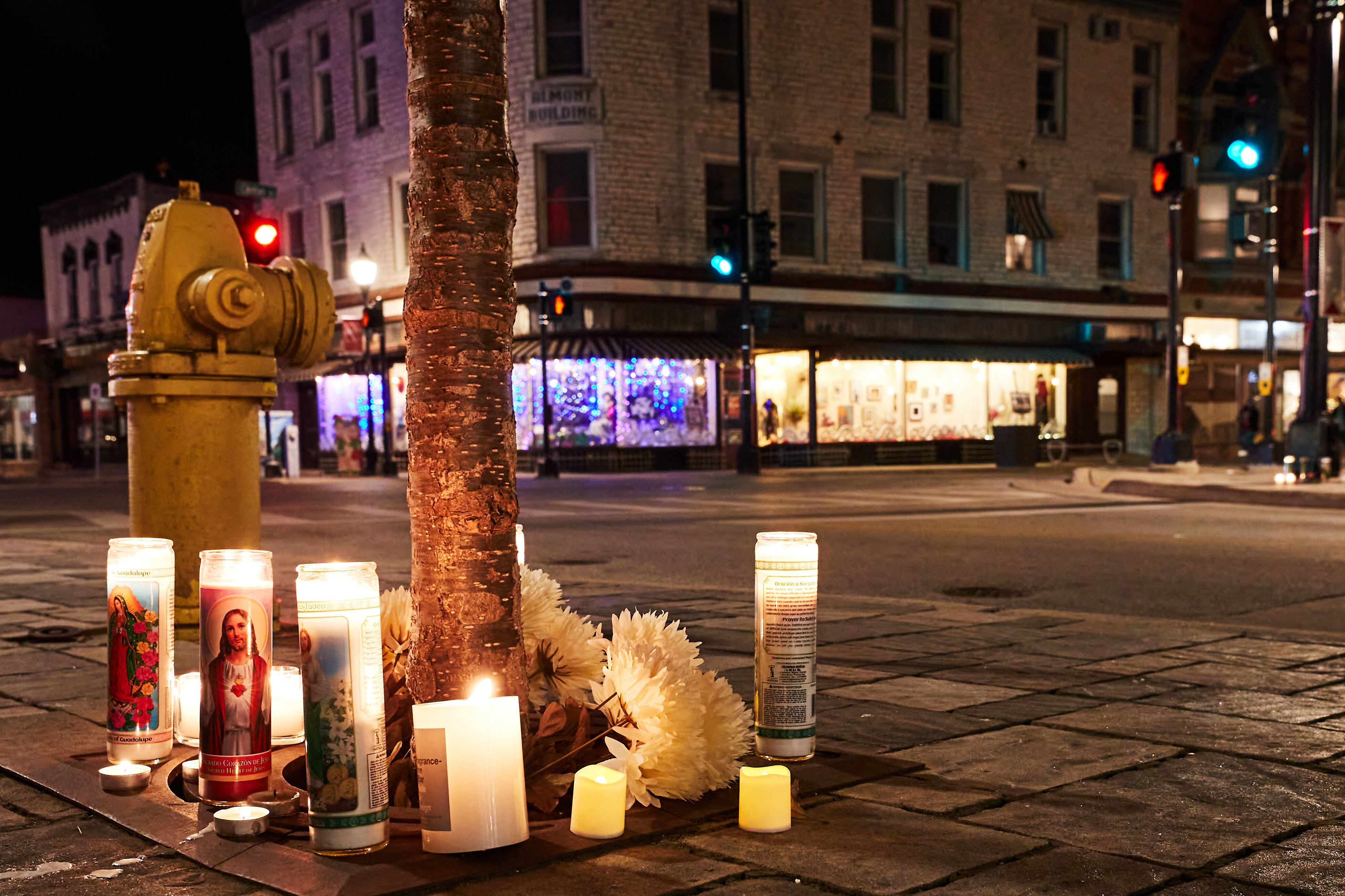 A makeshift memorial is pictured along the route of the parade on W Main Street in Waukesha, Wisconsin on November 22, 2021, the day after a vehicle drove through a Christmas parade killing five people. - US authorities identified the driver suspected of plowing into a Christmas parade in the Midwestern city of Waukesha, killing at least five and wounding dozens, as media reported he was fleeing a knife fight. The Sunday evening chaos in Wisconsin, which saw a red SUV speed into a crowd of men, women and children raised immediate fears of a deliberate act -- in a state where tensions have spiked following a high-profile acquittal in a racially-charged trial. (Photo by Mustafa Hussain / AFP) (Photo by MUSTAFA HUSSAIN/AFP via Getty Images)