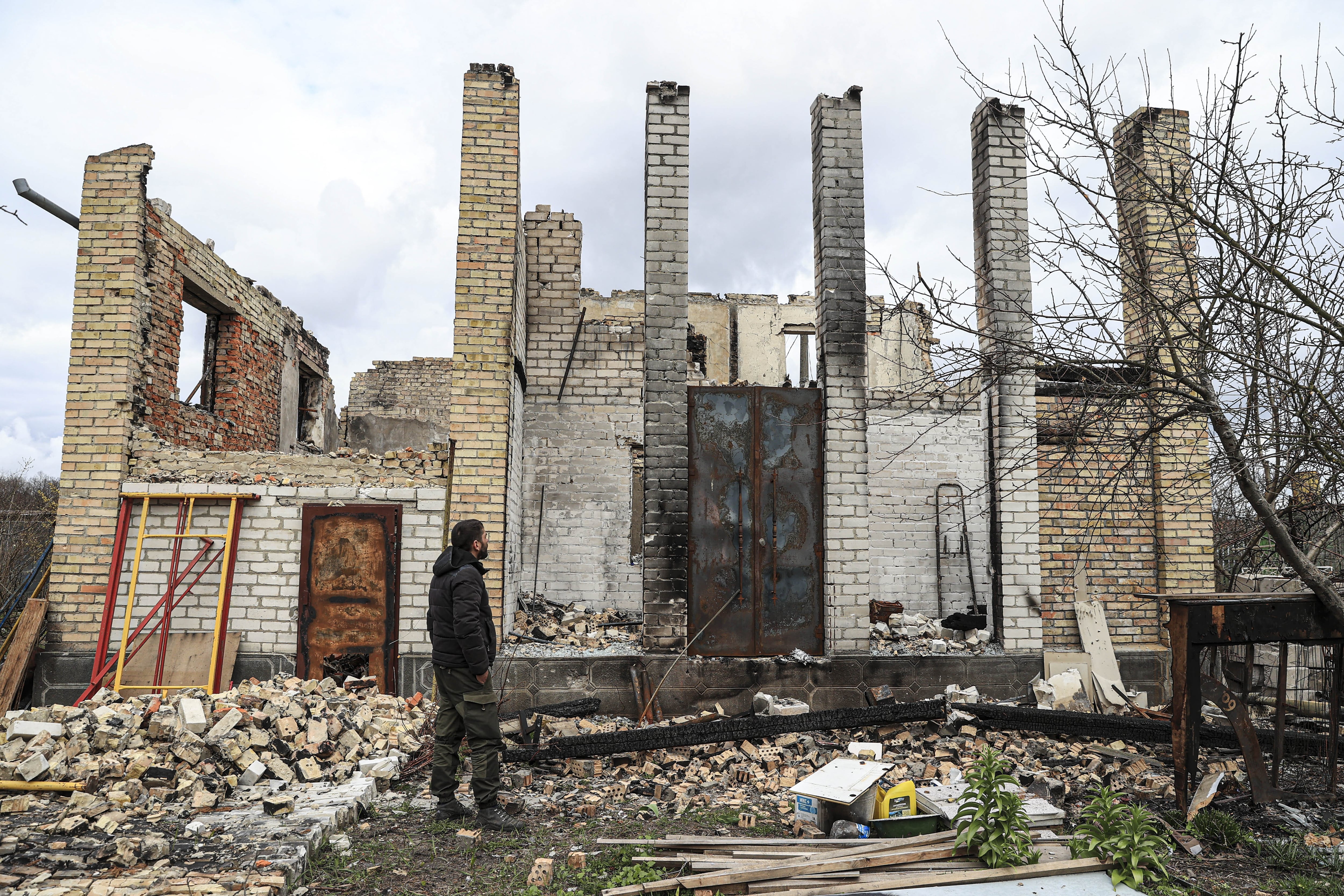 KYIV, UKRINE - APRIL 17: Sergey Kutsenko, who bought an old house in the nature-rich village of Moschun by selling his house in Kyiv, but whose house was destroyed as a result of the Russian attacks, is seen during an exclusive interview at his destroyed house in Moschun district of Kyiv Oblast, Ukraine on April 17, 2022. Since the first day of Russian attacks, village of Moschun has been target of airstrikes due to closeness to military airport located in Gostomel district of Ukrainian capital Kyiv. Many families have lost their houses at the ruined village of Moschun during Russian attacks since February 24th. (Photo by Metin Aktas/Anadolu Agency via Getty Images)