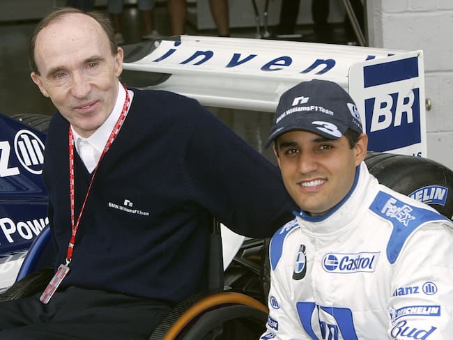 Columbian BMW-Williams driver Juan Pablo Montoya (R) pose with English BMW-Williams team Director Frank Williams in the pits of the Silverstone racetrack, 18 July 2003, before the first free practice session two days before the British Formula One Grand Prix.   AFP PHOTO PIERRE ANDRIEU  (Photo credit should read PIERRE ANDRIEU/AFP via Getty Images)