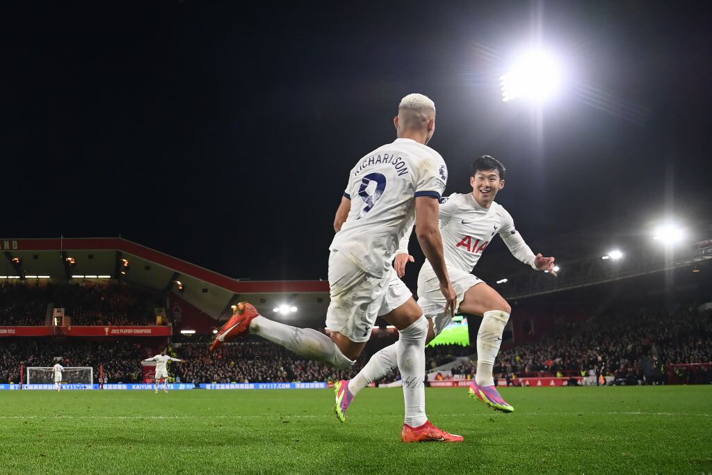 NOTTINGHAM, ENGLAND - DECEMBER 15: Richarlison of Tottenham Hotspur celebrates scoring their team's first goal with Son Heung-min during the Premier League match between Nottingham Forest and Tottenham Hotspur at City Ground on December 15, 2023 in Nottingham, England. (Photo by Michael Regan/Getty Images)