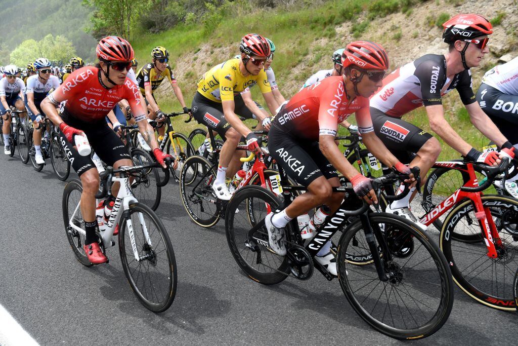 Team Lotto's Brent Van Moer of Belgium wearing the overall leader's yellow jersey rides next to Team Arkea - Samsic's Nairo Quintana of Colombia (2nd-R) during the second stage of the 73rd edition of the Criterium du Dauphine cycling race, 173km between Brioude and Saugues on May 31, 2021. (Photo by Alain JOCARD / AFP) (Photo by ALAIN JOCARD/AFP via Getty Images)