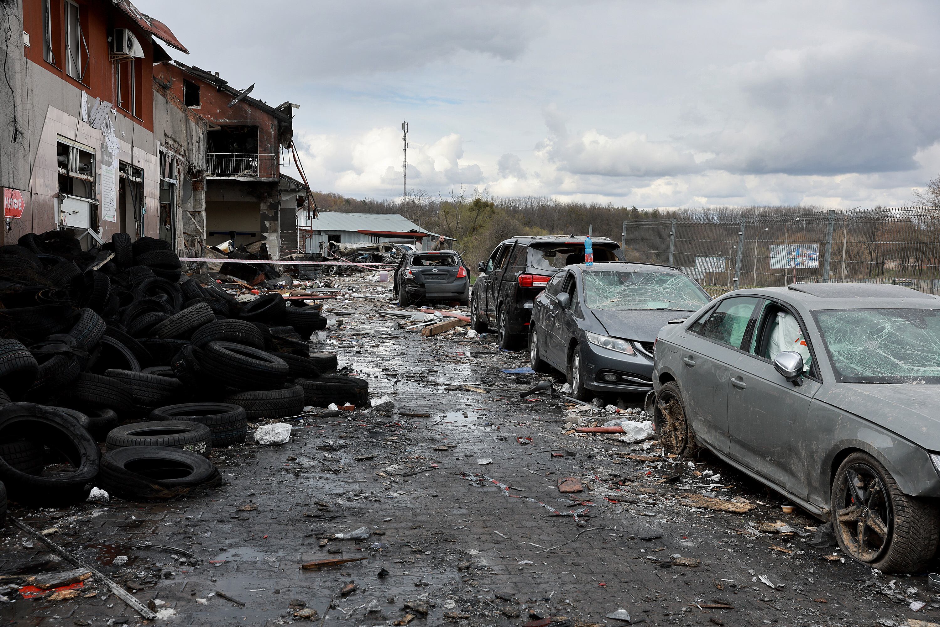 LVIV, UKRAINE - APRIL 18: Damaged cars are seen after a civilian building was hit by a Russian missile on April 18, 2022 in Lviv, Ukraine. At least six people were killed and eleven wounded in missile strikes in different areas of the city according to the Mayor of Lviv. (Photo by Joe Raedle/Getty Images)