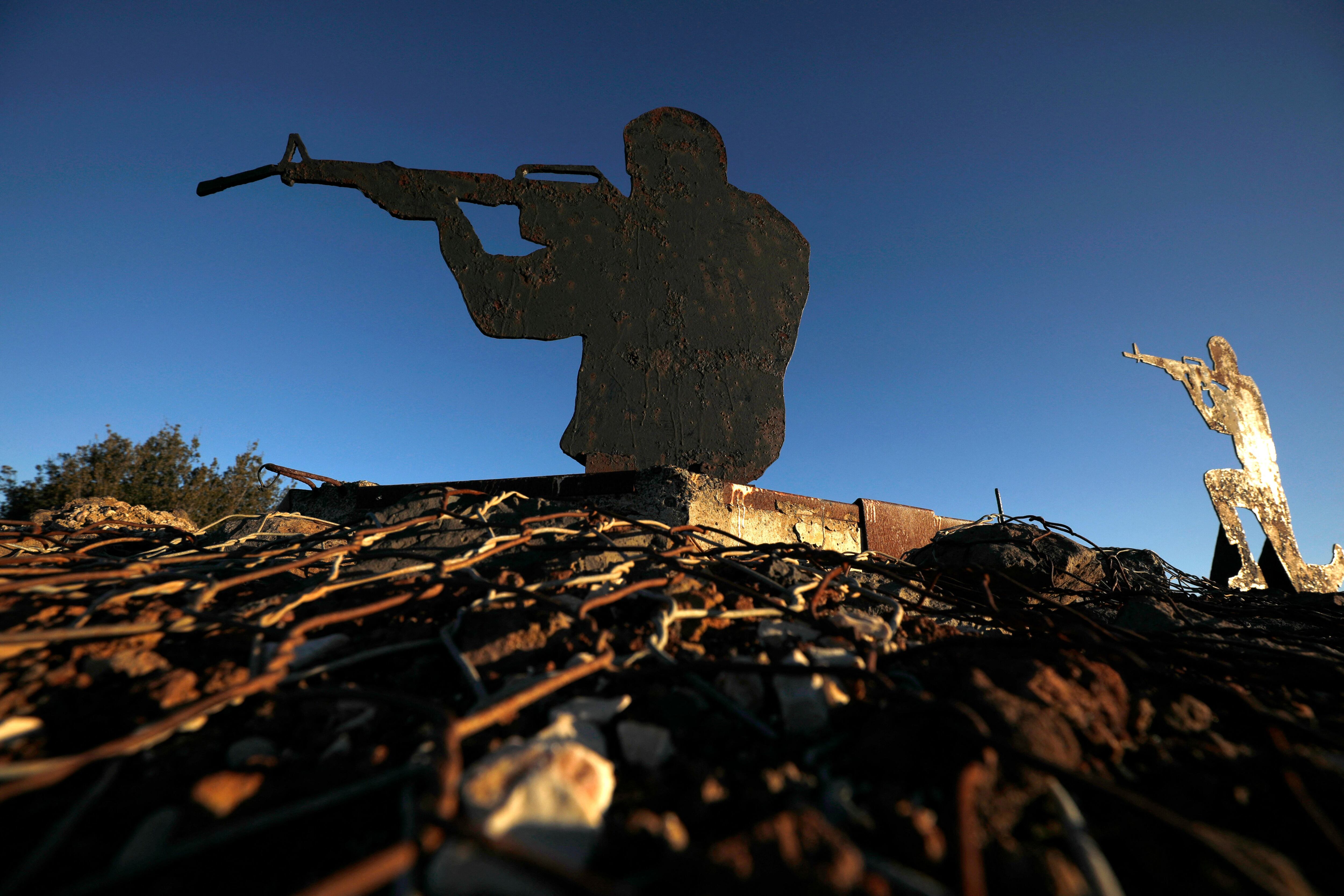 A metal cutout of an Israeli soldier at an army post in Mount Bental near the Syrian border in the Israeli-annexed Golan Heights on February 9, 2022. - Israel launched strikes against targets in Syria early today, hitting anti-aircraft batteries in response to a missile fired from Syria, the military said. (Photo by JALAA MAREY / AFP) (Photo by JALAA MAREY/AFP via Getty Images)