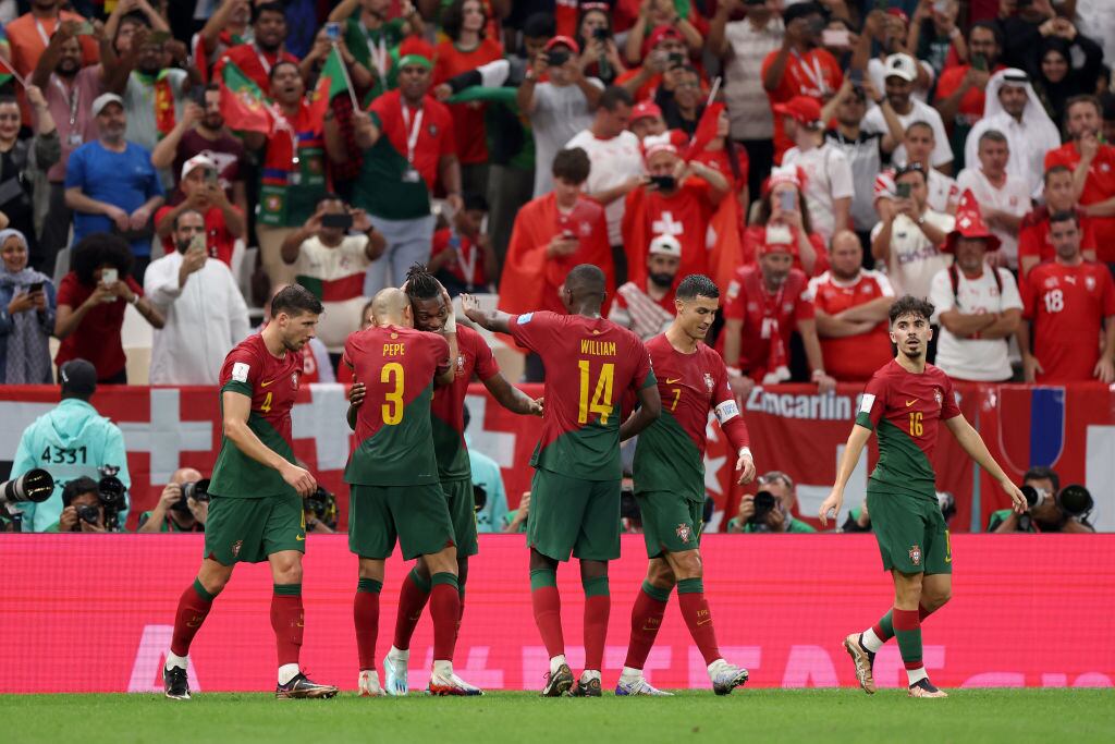 LUSAIL CITY, QATAR - DECEMBER 06: Rafael Leao of Portugal celebrates with Pepe after scoring the team's sixth goal during the FIFA World Cup Qatar 2022 Round of 16 match between Portugal and Switzerland at Lusail Stadium on December 06, 2022 in Lusail City, Qatar. (Photo by Francois Nel/Getty Images)
