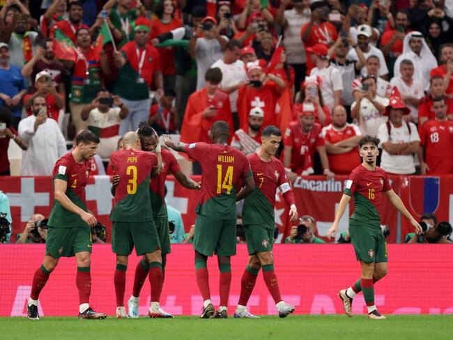LUSAIL CITY, QATAR - DECEMBER 06: Rafael Leao of Portugal celebrates with Pepe after scoring the team's sixth goal during the FIFA World Cup Qatar 2022 Round of 16 match between Portugal and Switzerland at Lusail Stadium on December 06, 2022 in Lusail City, Qatar. (Photo by Francois Nel/Getty Images)