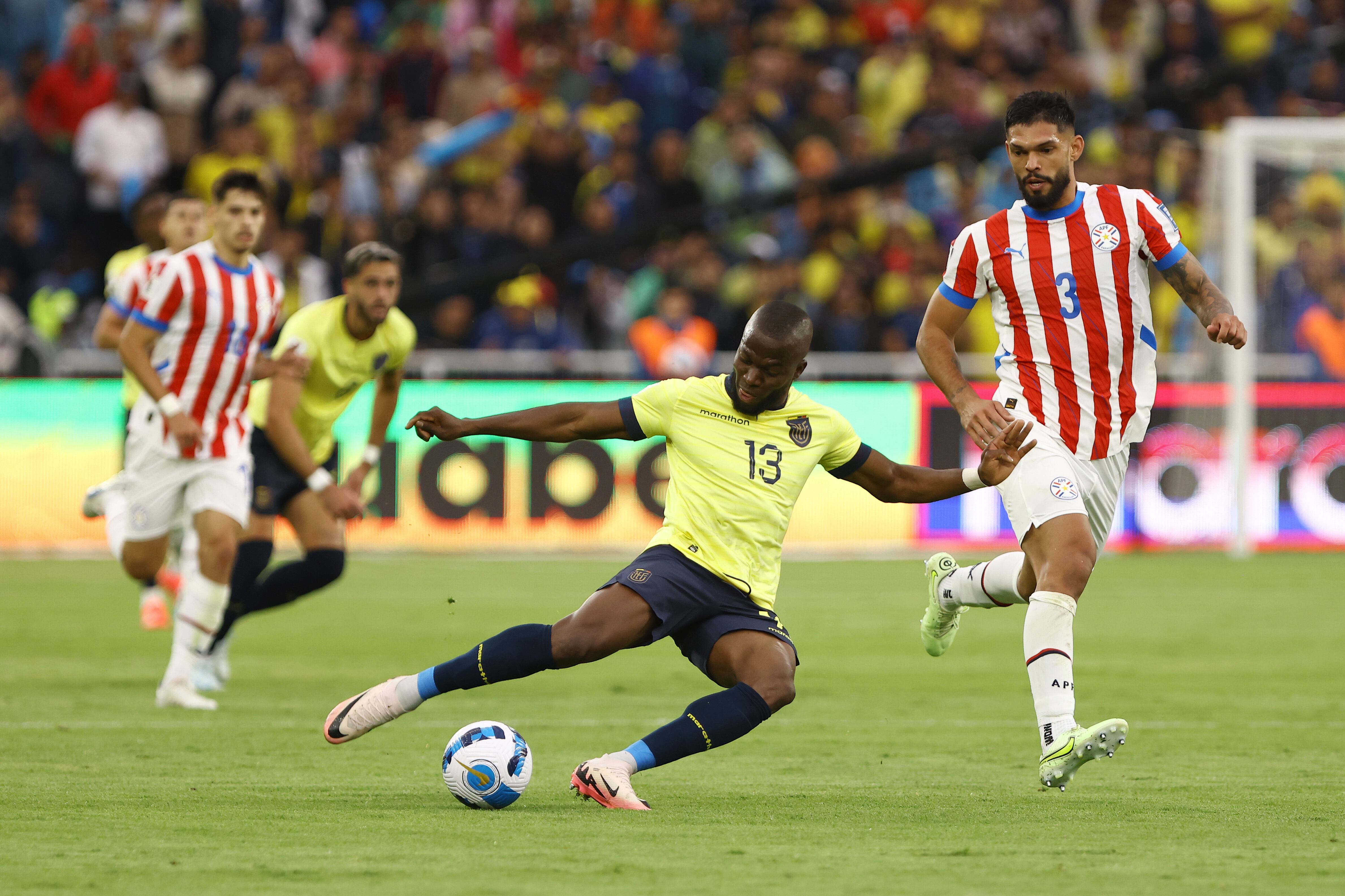 QUITO, ECUADOR - OCTOBER 10: Enner Valencia of Ecuador kicks the ball against Omar Alderete of Paraguay during the FIFA World Cup 2026 South American Qualifier match between Ecuador and Paraguay at Rodrigo Paz Delgado Stadium on October 10, 2024 in Quito, Ecuador. (Photo by Franklin Jacome/Getty Images)