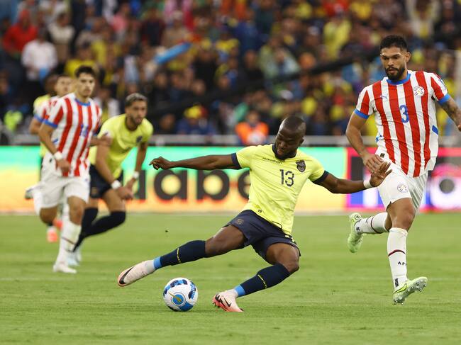 QUITO, ECUADOR - OCTOBER 10: Enner Valencia of Ecuador kicks the ball against Omar Alderete of Paraguay during the FIFA World Cup 2026 South American Qualifier match between Ecuador and Paraguay at Rodrigo Paz Delgado Stadium on October 10, 2024 in Quito, Ecuador. (Photo by Franklin Jacome/Getty Images)