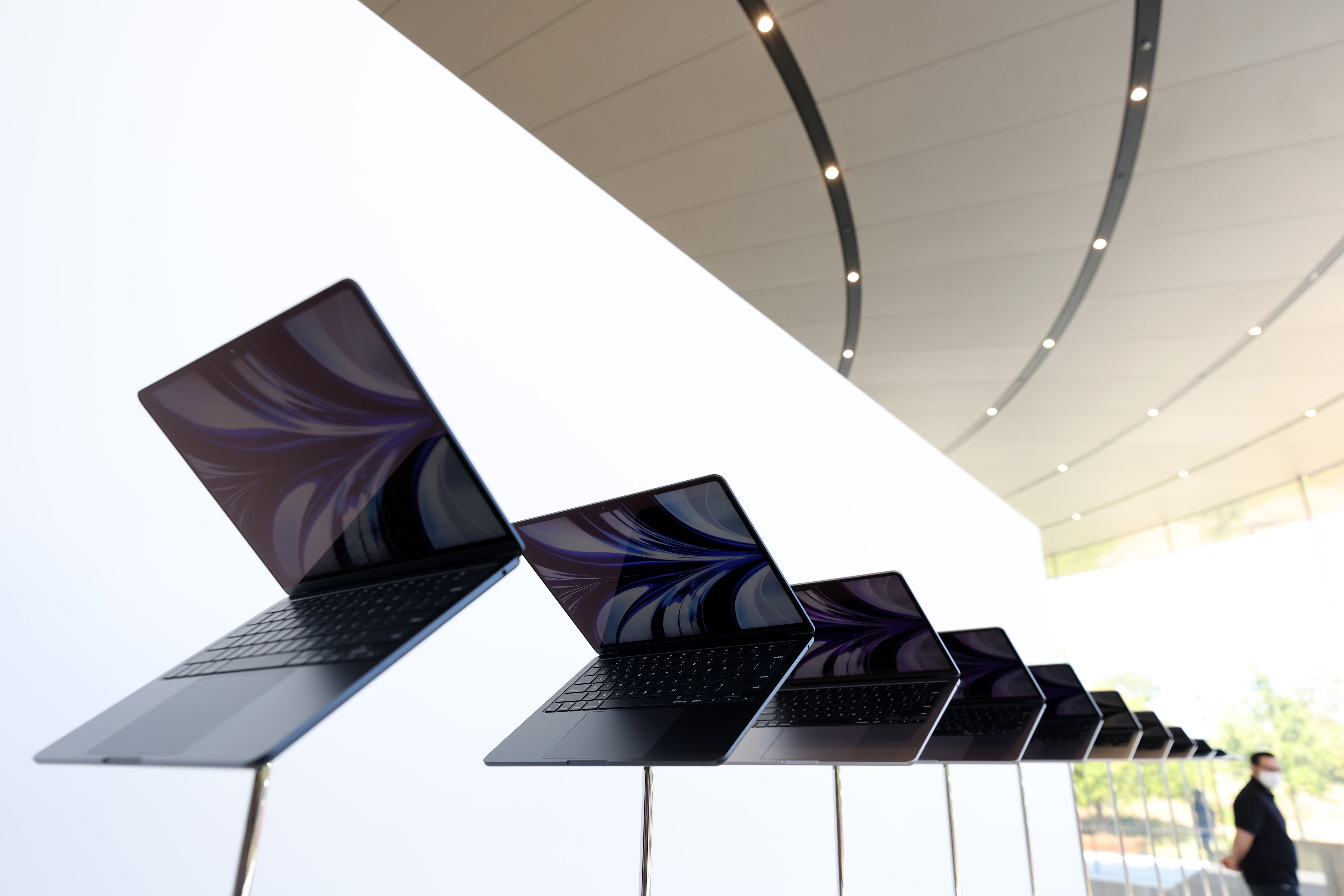 CUPERTINO, CALIFORNIA - JUNE 06: Newly redesigned MacBook Air laptops are seen displayed during the WWDC22 at Apple Park on June 06, 2022 in Cupertino, California. Apple CEO Tim Cook kicked off the annual WWDC22 developer conference.  (Photo by Justin Sullivan/Getty Images)
