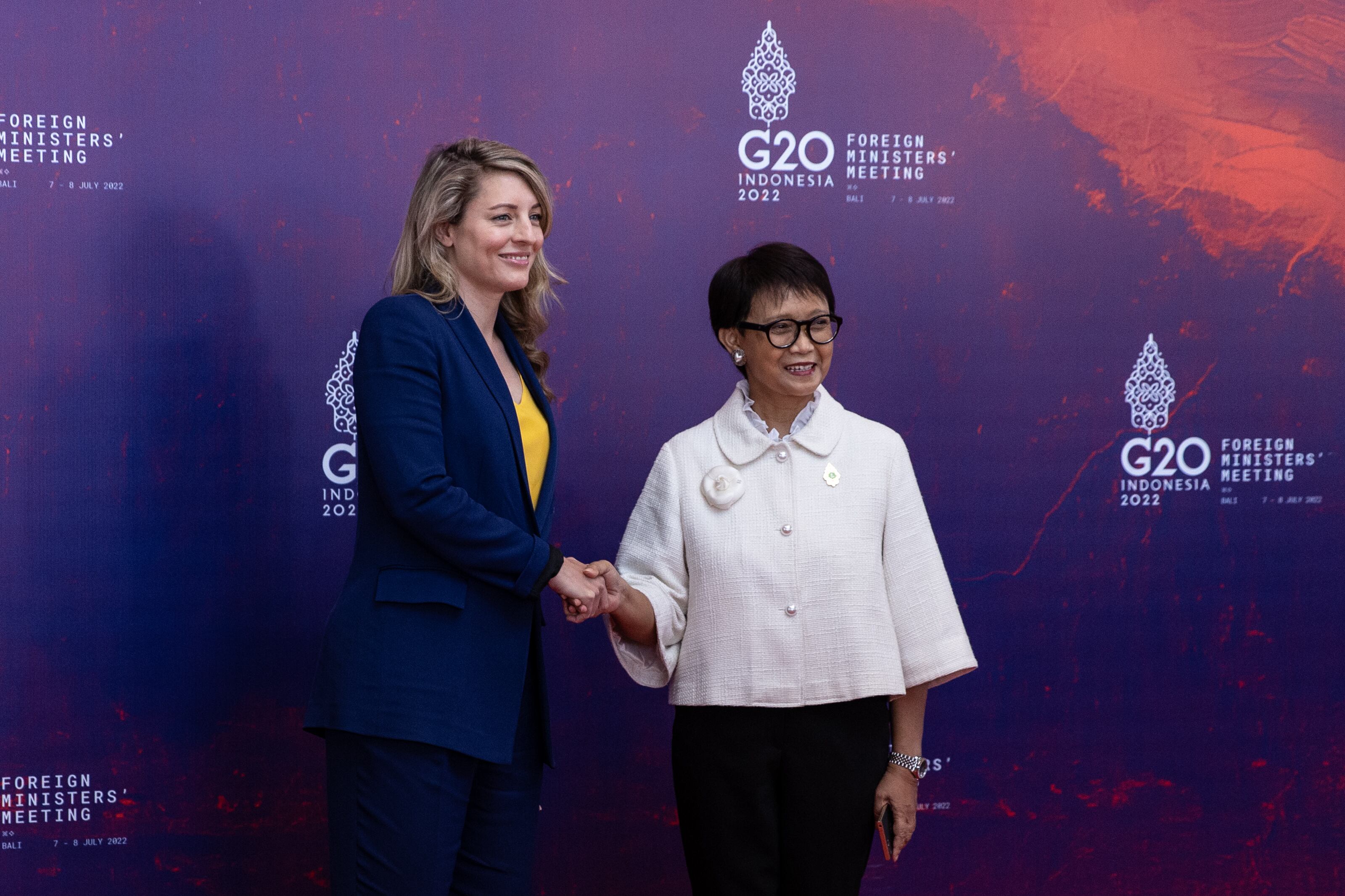 NUSA DUA, INDONESIA - JULY 08: The Indonesian Minister for Foreign Affairs, Retno Marsudi (R) greets the Minister for Foreign Affairs of Canada, Melanie Joly (L) during arrival of the G20 Foreign Ministers and Head of Department at the Grand Ballroom Mulia Hotel on July 08, 2022 in Nusa Dua, Indonesia. (Photo by Robertus Pudyanto/Getty Images)