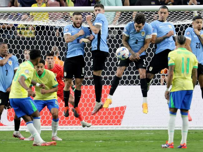 Las Vegas (United States), 07/07/2024.- Jose Gimenez of Uruguay (3-R) blocks a shot on goal during the CONMEBOL Copa America 2024 Quarter-finals match between Uruguay and Brazil, in Las Vegas, Nevada, USA, 06 July 2024. (Brasil) EFE/EPA/ALLISON DINNER