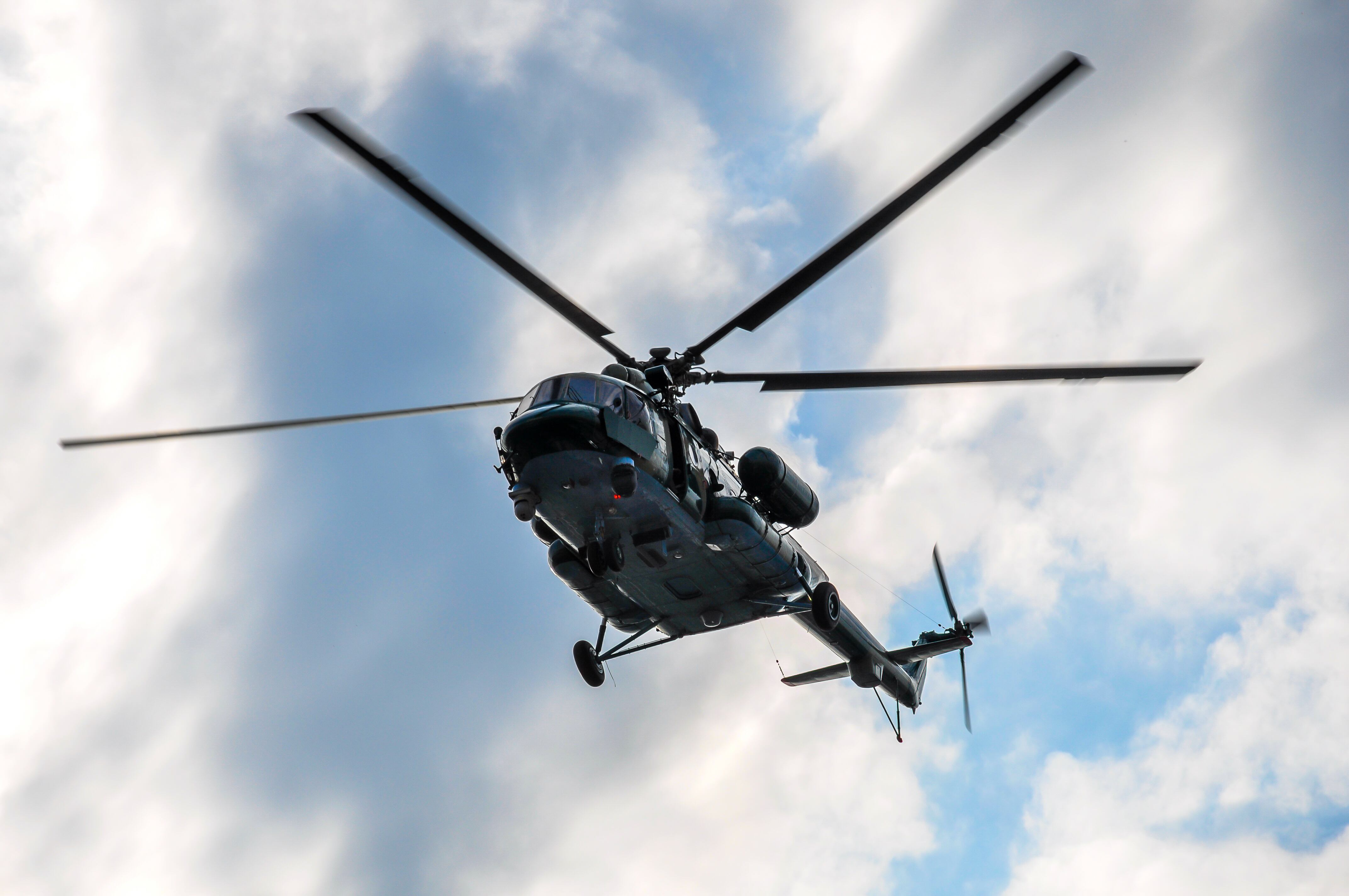 Moscow, Russia – May 06, 2012: Mi-8AMTSh MI-17, MI-171SH in the sky over Moscow, Russia on a background of clouds, photographed near the Kremlin