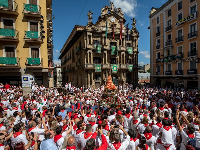PAMPLONA, SPAIN - JULY 07: Men carry a figure of San Fermin along Plaza Consistorial during the San Fermin procession on the second day of the San Fermin Running of the Bulls festival on July 07, 2022 in Pamplona, Spain. The iconic Spanish festival has resumed in earnest this year after being twice cancelled due to Covid-19. (Photo by Pablo Blazquez Dominguez/Getty Images)