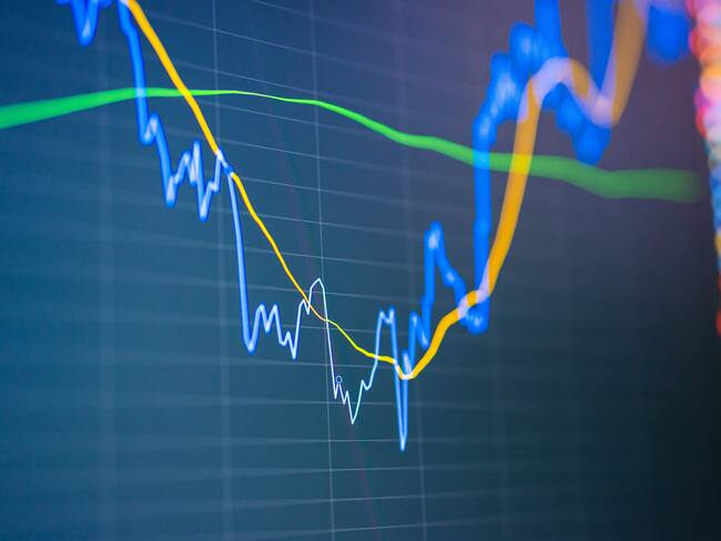 Close-up financial using online analyze exchange rate diagram. Investor businessman analyzing a graphic of stock cryptocurrency exchange chart