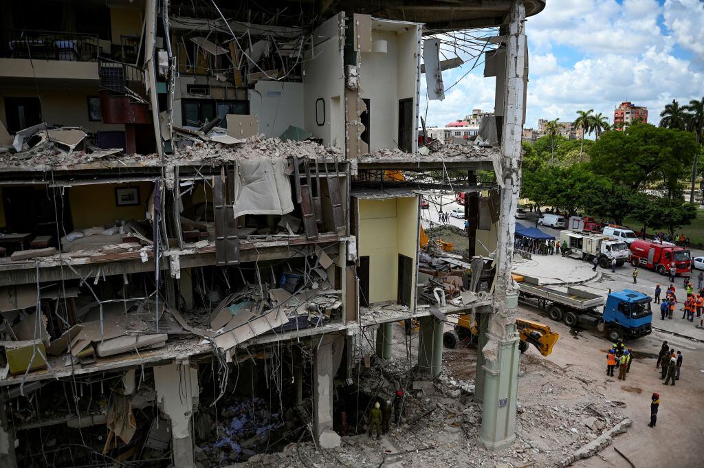 View of the ruins of the Saratoga Hotel, following an explosion on the eve, in Havana, on May 7, 2022. - Rescuers combed through what remained of a luxury Havana hotel Saturday, as the death toll after a powerful blast due to a suspected gas leak climbed to 26, authorities said. (Photo by YAMIL LAGE / AFP) (Photo by YAMIL LAGE/AFP via Getty Images)