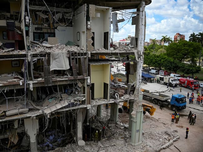 View of the ruins of the Saratoga Hotel, following an explosion on the eve, in Havana, on May 7, 2022. - Rescuers combed through what remained of a luxury Havana hotel Saturday, as the death toll after a powerful blast due to a suspected gas leak climbed to 26, authorities said. (Photo by YAMIL LAGE / AFP) (Photo by YAMIL LAGE/AFP via Getty Images)
